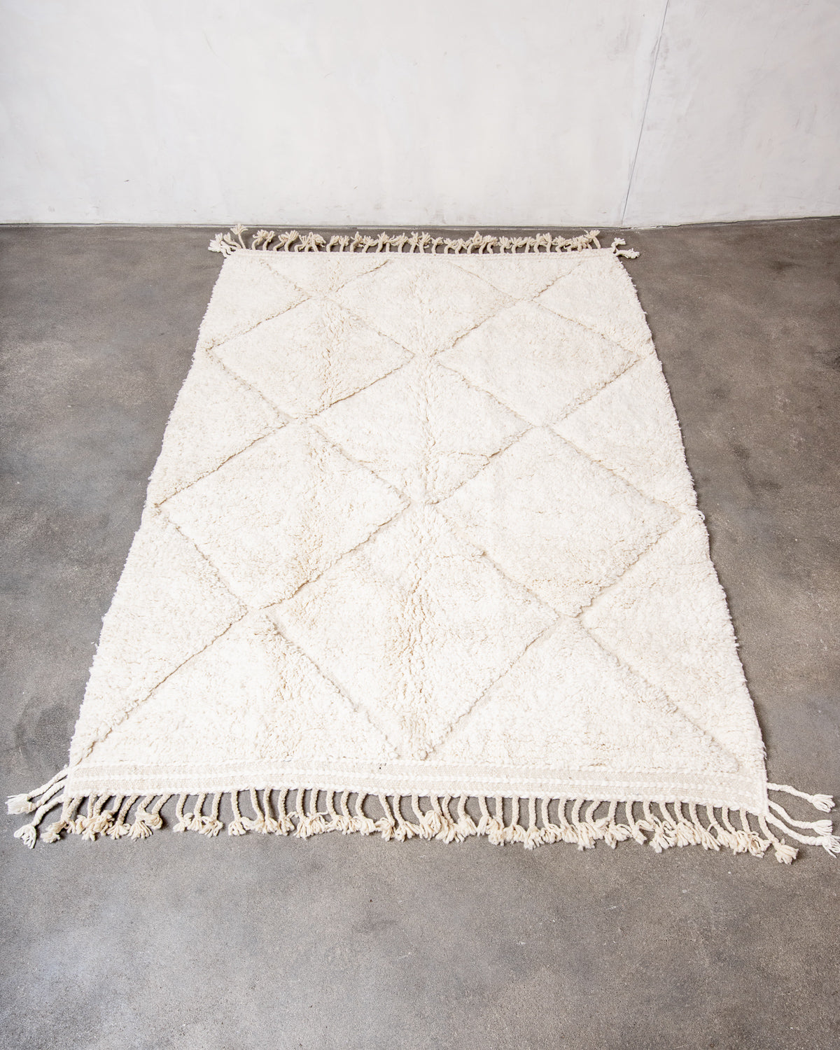 Modern, designer, handcrafted Berber rug from Morocco. Beniourain carpet with minimalist design, natural wool pile and a fluffy texture.